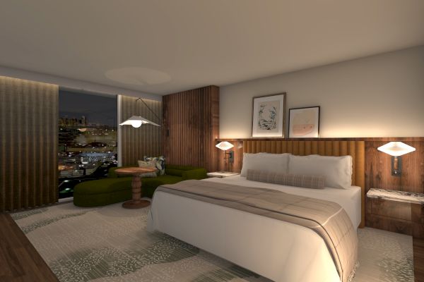 A modern hotel room with a king-sized bed, wooden accents, a green sofa, and a night view through large windows is shown.